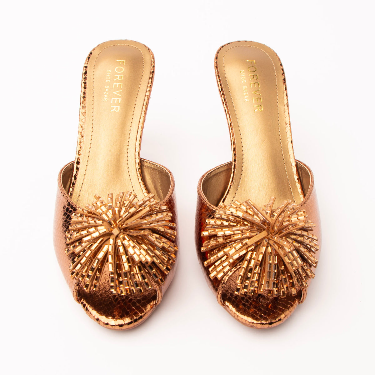 Brown mules for women, both shoes from the front