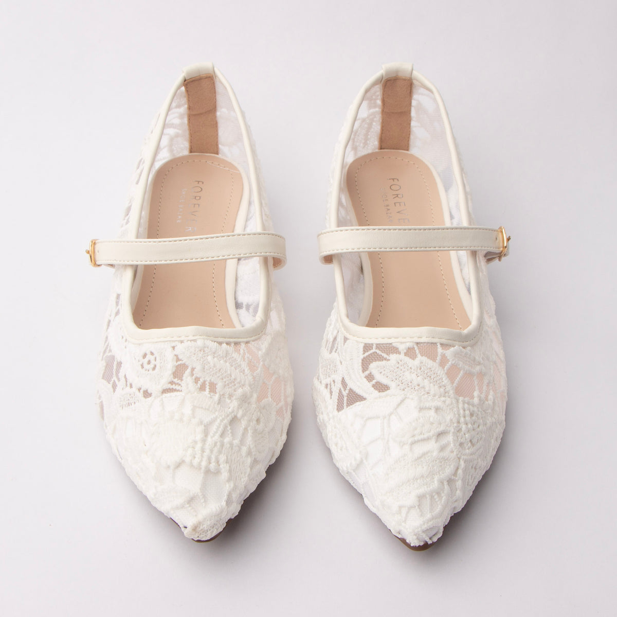 White Mary Janes for women, both shoes from the front