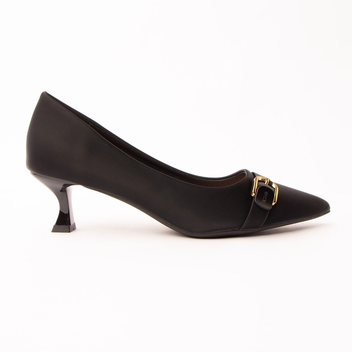 Black buckle kitten heels for women, a sharply pointed matte black court with a low plain instep and a waved topline, crossed by a slim self-colour band caught in a gold pin buckle, on a low flared kitten heel in glossy black patent
