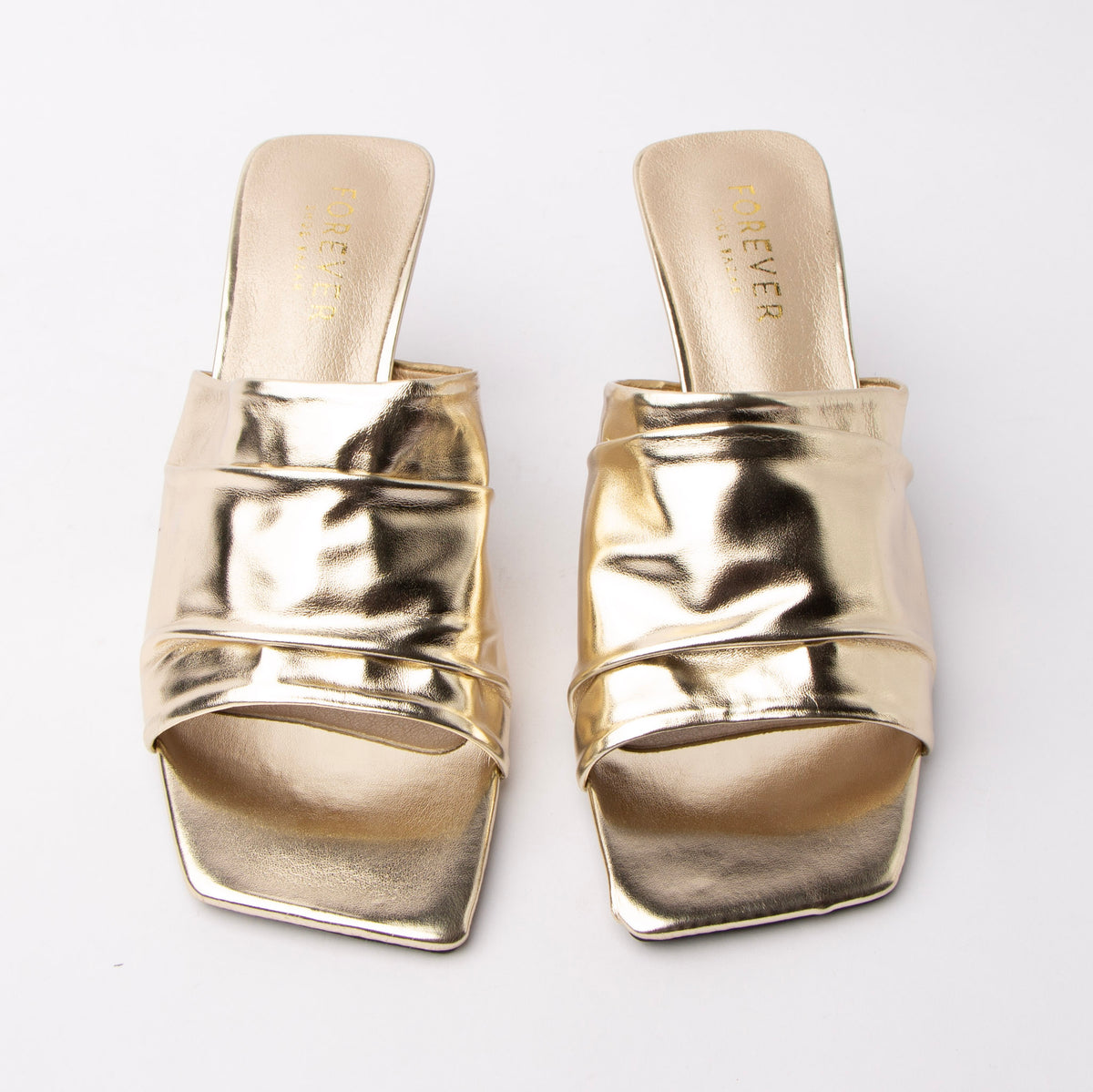 Gold metallic mules styled for everyday wear