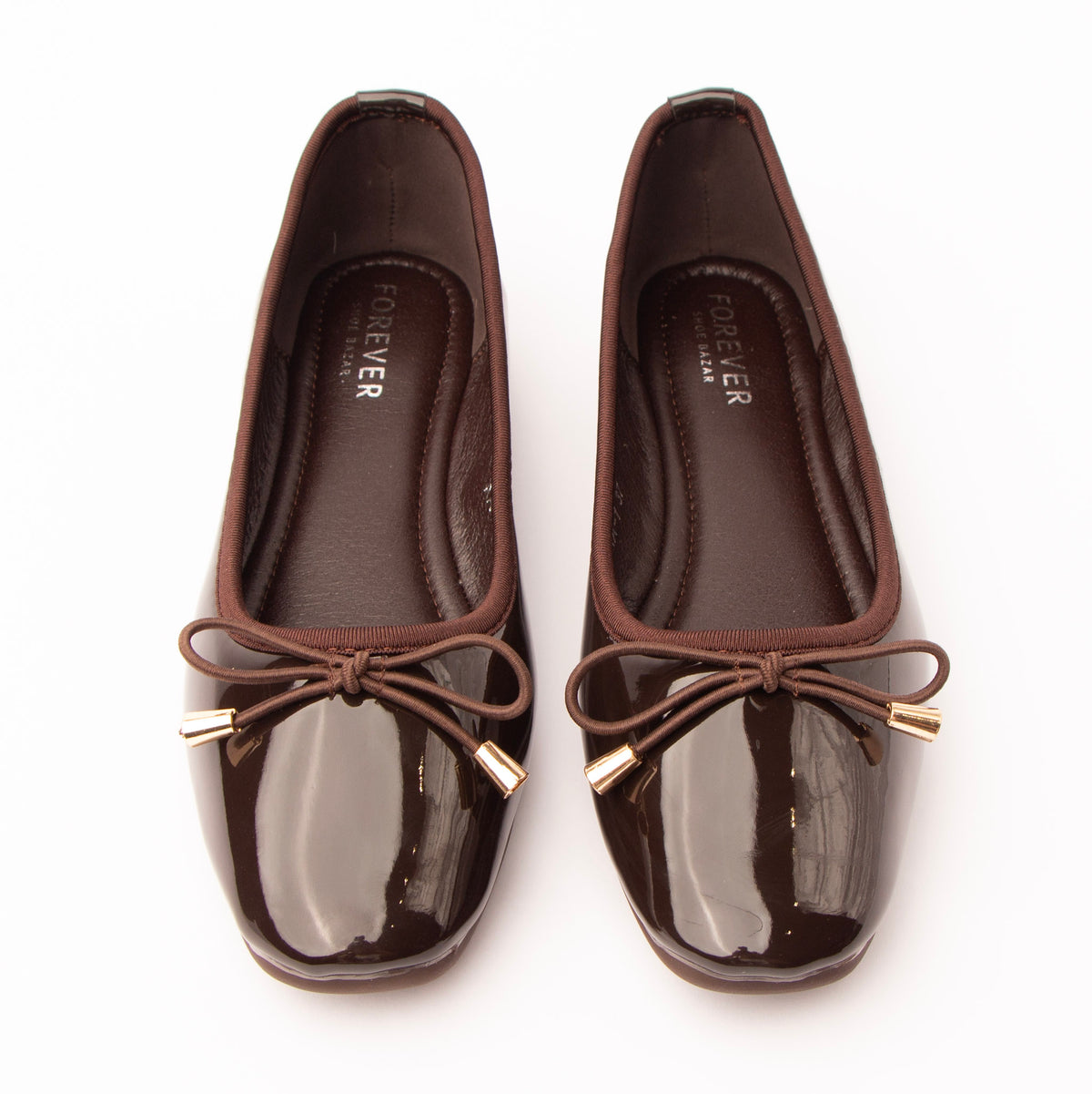 Brown patent ballerina flats styled for everyday wear