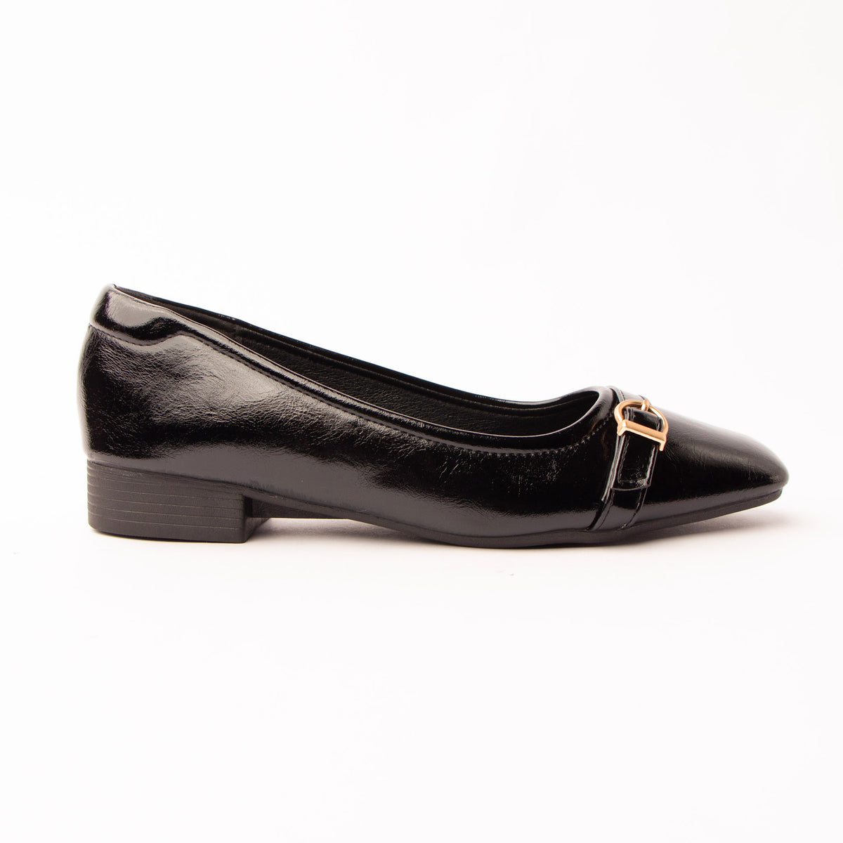 Black buckle ballerinas for women, a high-shine black patent-look ballerina with a lightly crinkled surface, a narrow self-colour strap fastening off-centre through a small gold buckle, on a low black stacked heel