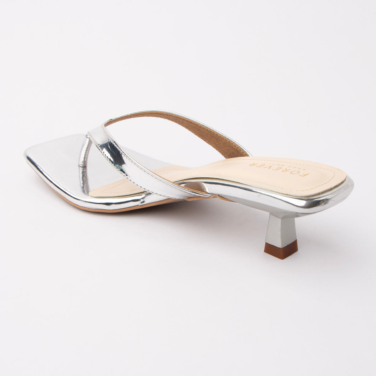 Silver toe-post kitten heel mules for women, back view showing the heel
