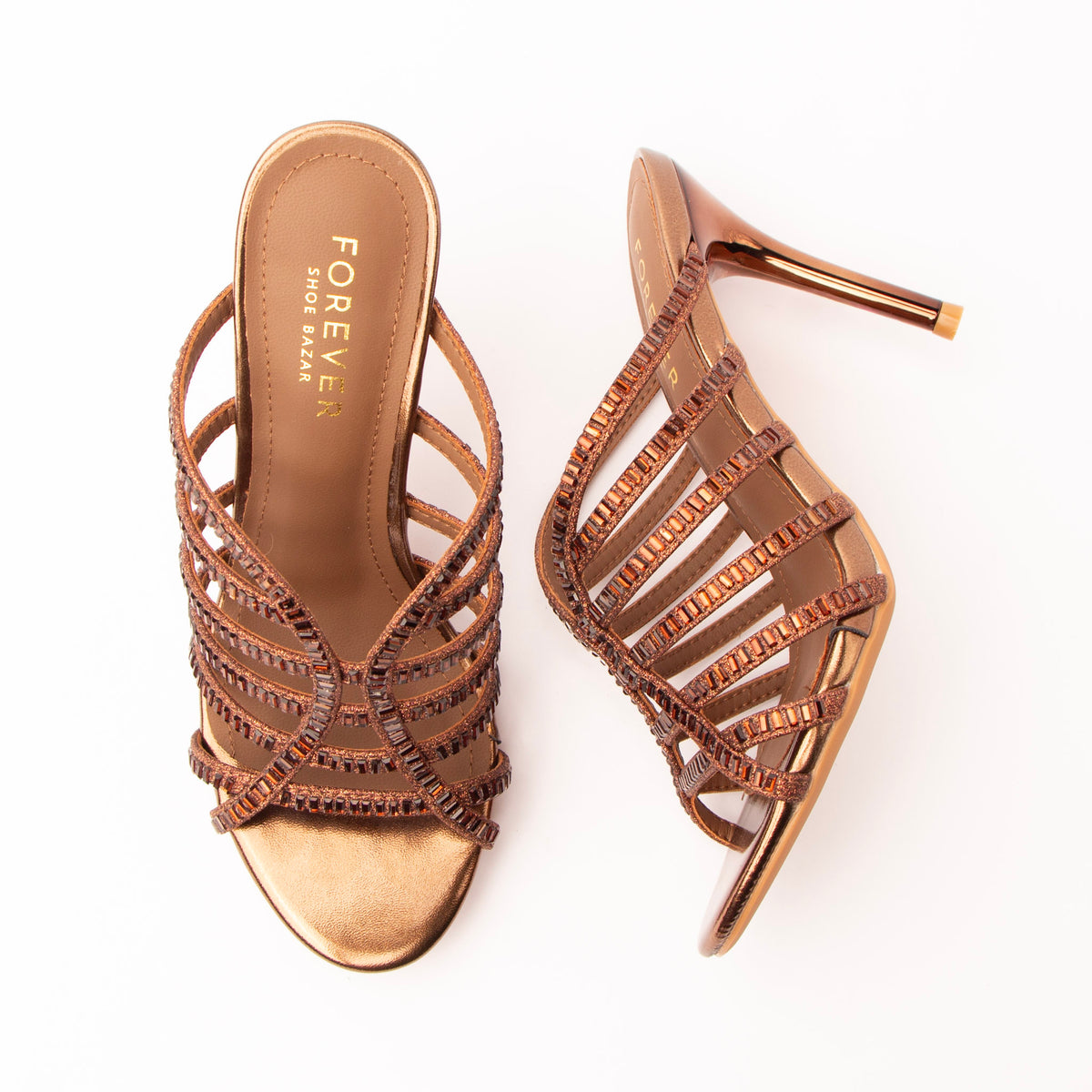 Brown mules for women, both shoes laid flat