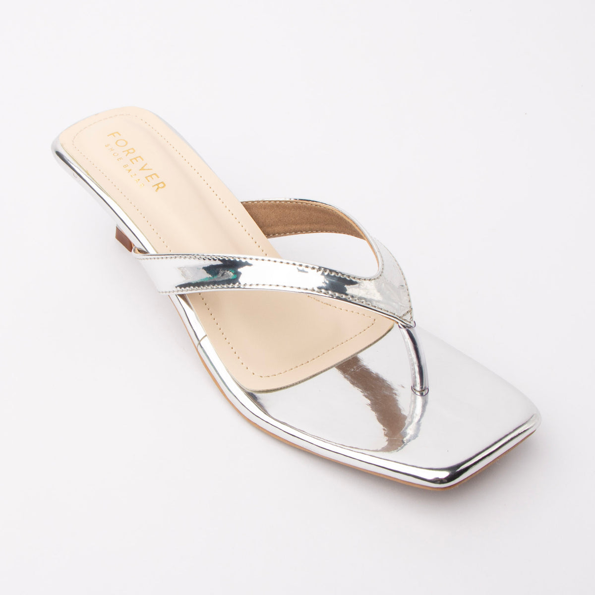 Silver toe-post kitten heel mules for women, three-quarter view