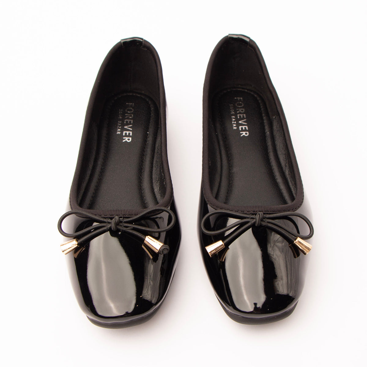 Black patent ballerina flats styled for everyday wear