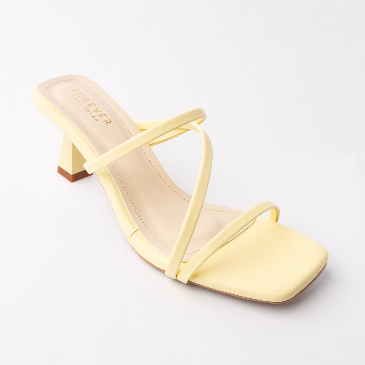 Yellow mules for women, three-quarter view