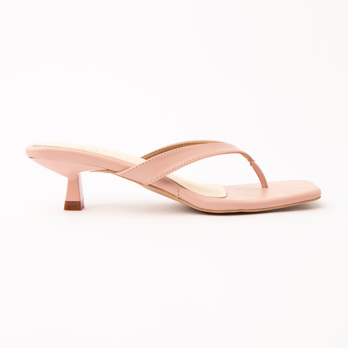 Peach toe-post kitten heel mules for women, side view of the twisted vamp band, squared-off open toe and slim kitten heel