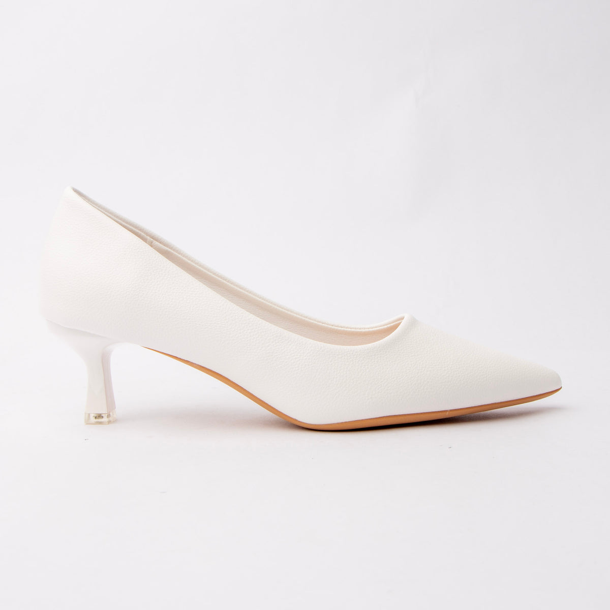 White pointed kitten heels for women, a bright optic-white pebble-grain court with a sharply pointed toe, on a matching white kitten heel finished with a small clear block over a natural tan sole edge
