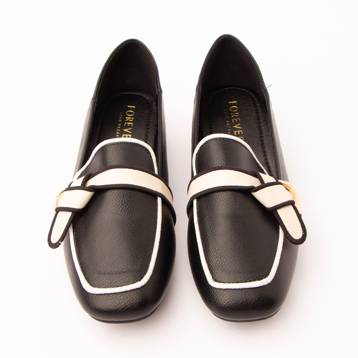 Black piped block heel loafers styled for everyday wear