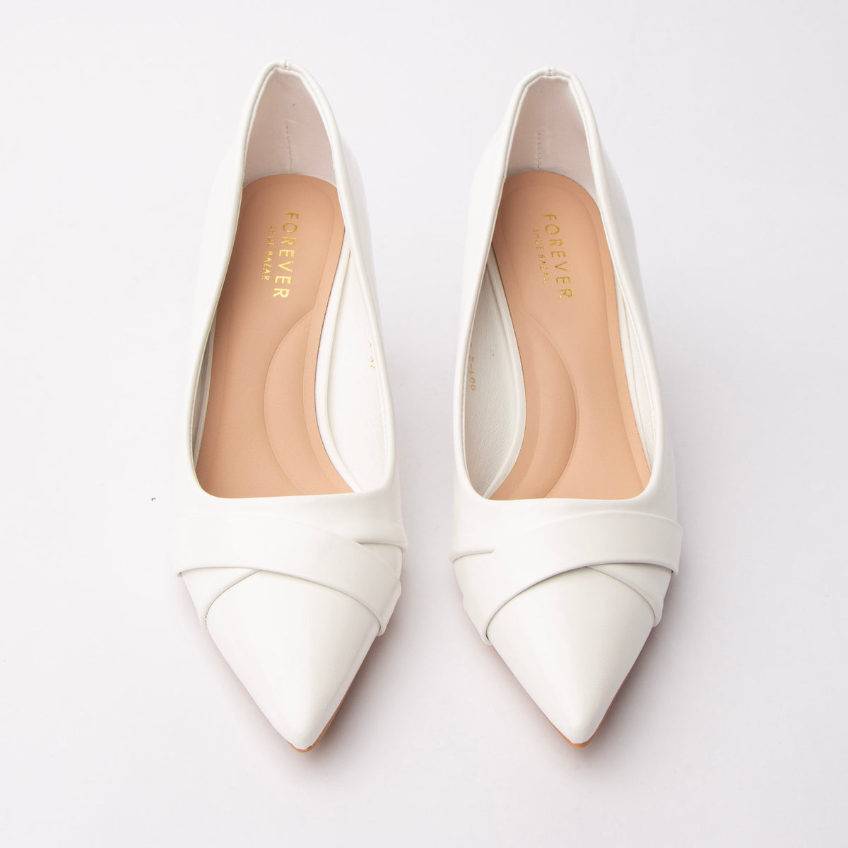 White folded strap pumps styled for everyday wear