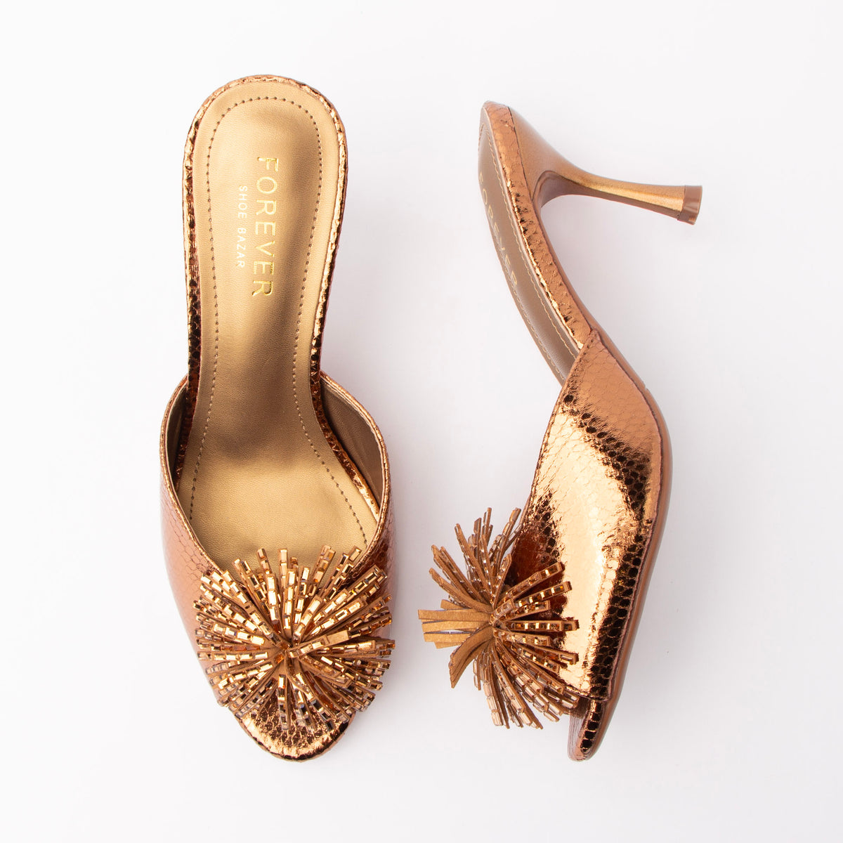 Brown mules for women, both shoes laid flat