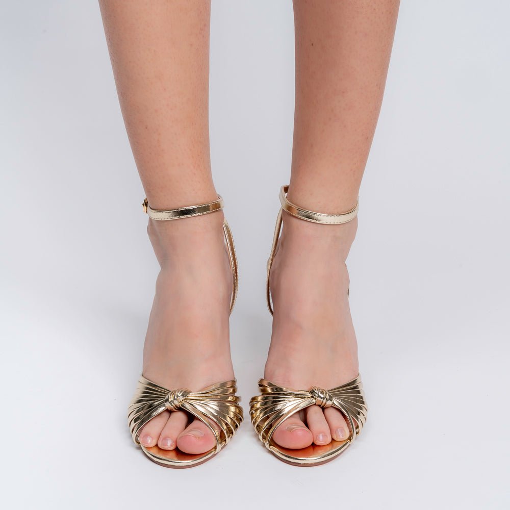 Gold woven strap stilettos for women showing the 10 cm heel