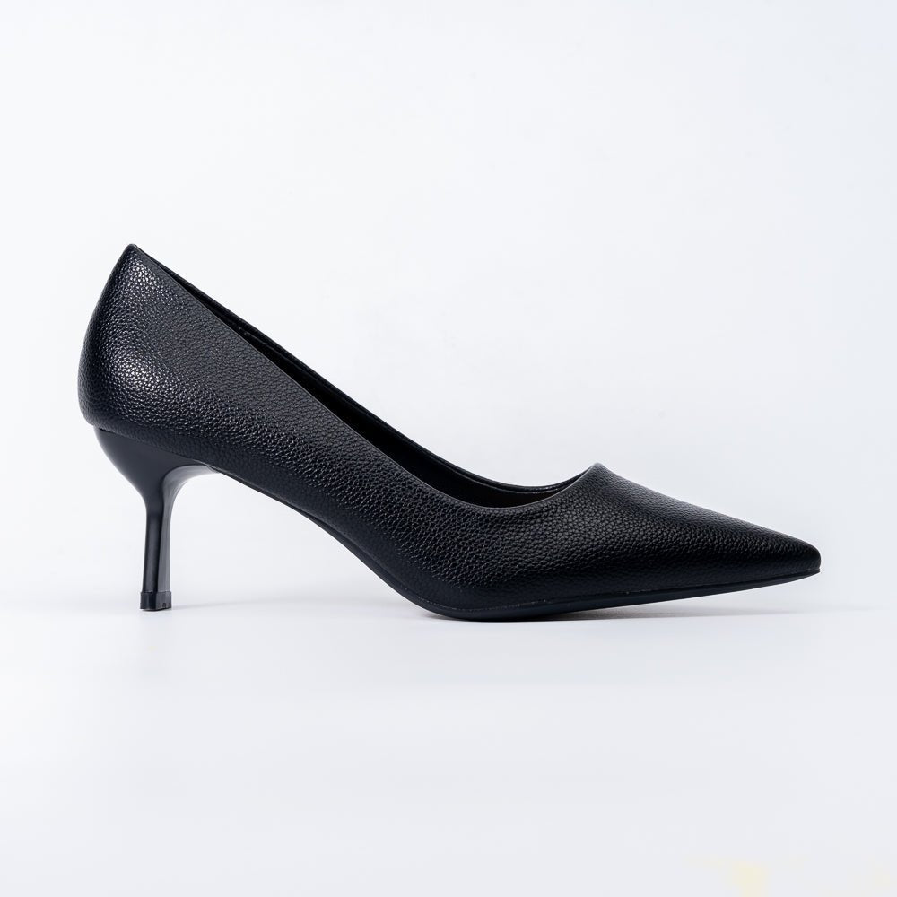 A realistic photograph of a bridal boutique aisle with elegant women trying pointed‑toe pumps, soft natural lighting, wa