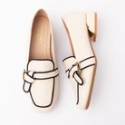 Beige piped block heel loafers for women with a cushioned footbed
