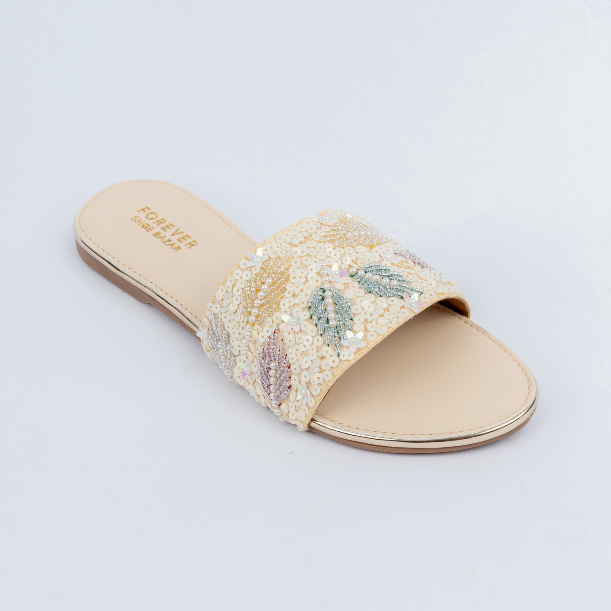 Cream sequin ballet flats styled for everyday casual wear