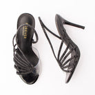 Black sandals for women, both shoes laid flat