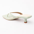 Green toe-post kitten heel mules for women, back view showing the heel