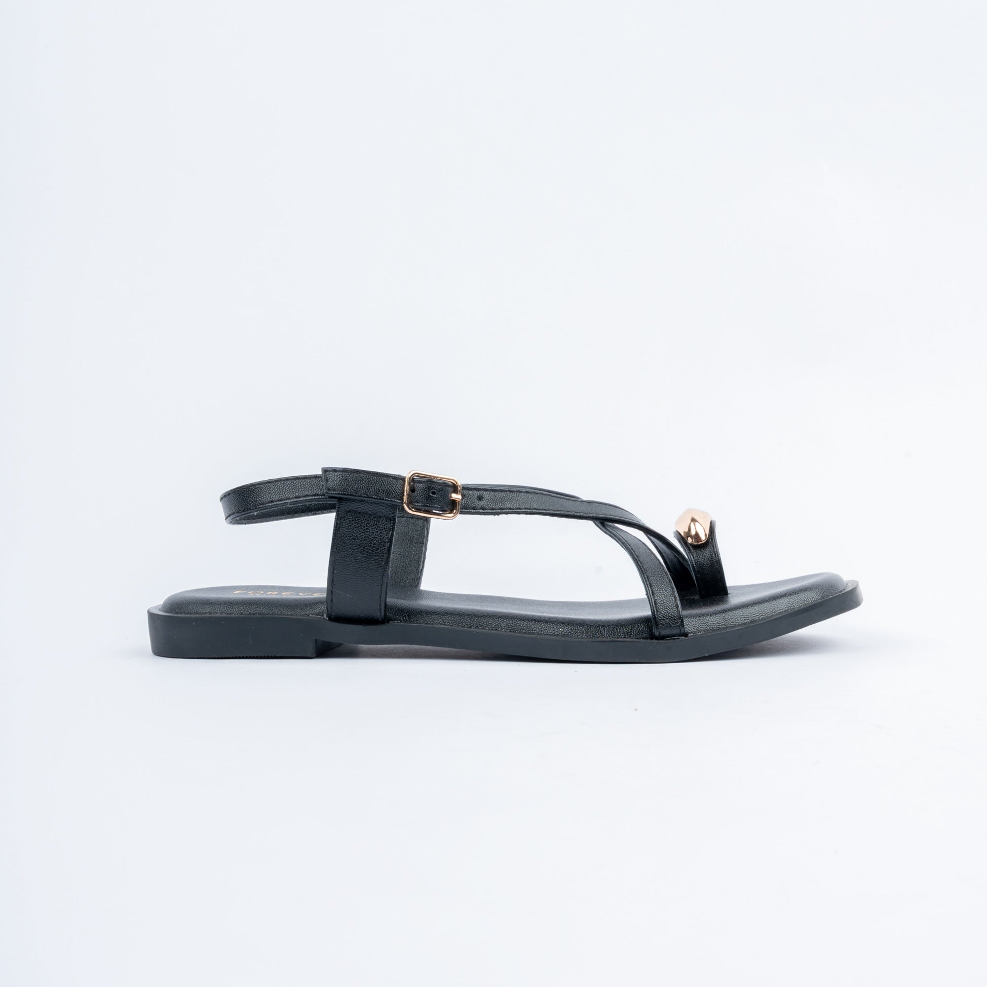 Black flat sandals styled for casual wear