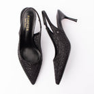 Black pumps for women, both shoes laid flat