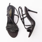 Black sandals for women, both shoes laid flat