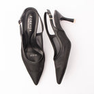 Black pumps for women, both shoes laid flat