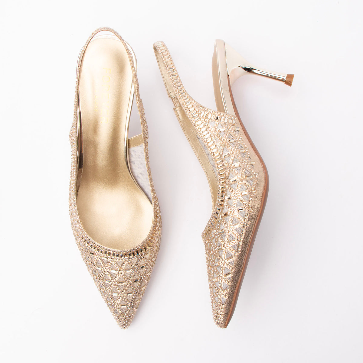Gold pumps for women, both shoes laid flat