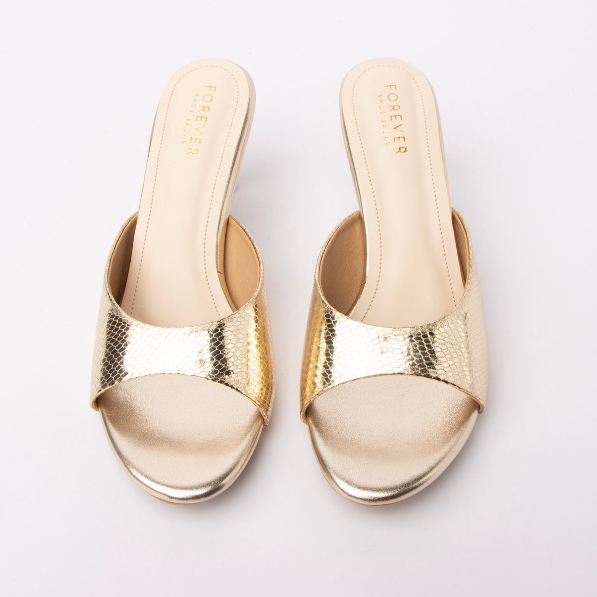 Gold snake print kitten heel mules for women with cushioned footbed, side view