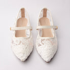 White Mary Janes for women, both shoes from the front