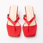 Red toe-post kitten heel mules for women, both shoes from the front