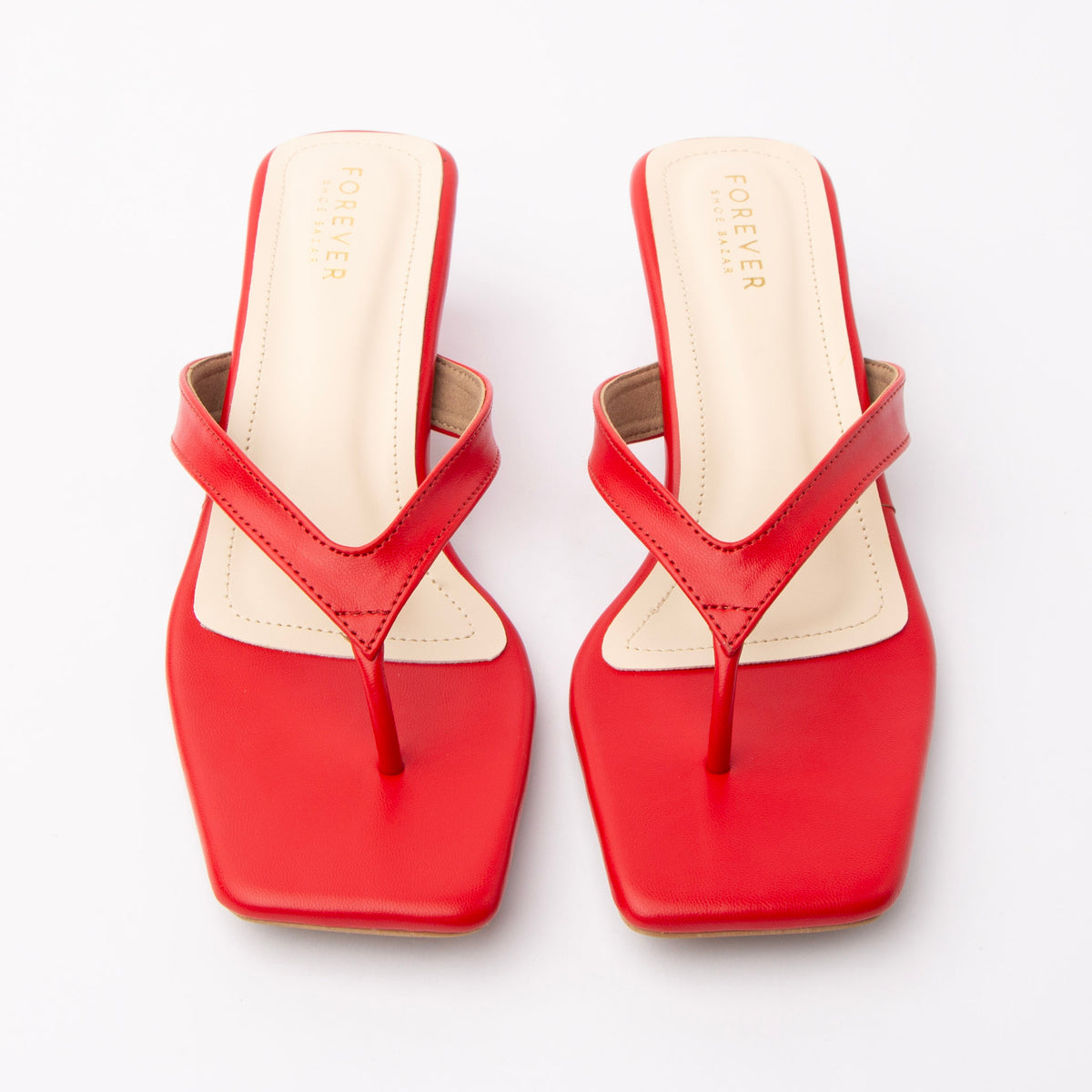 Red toe-post kitten heel mules for women, both shoes from the front