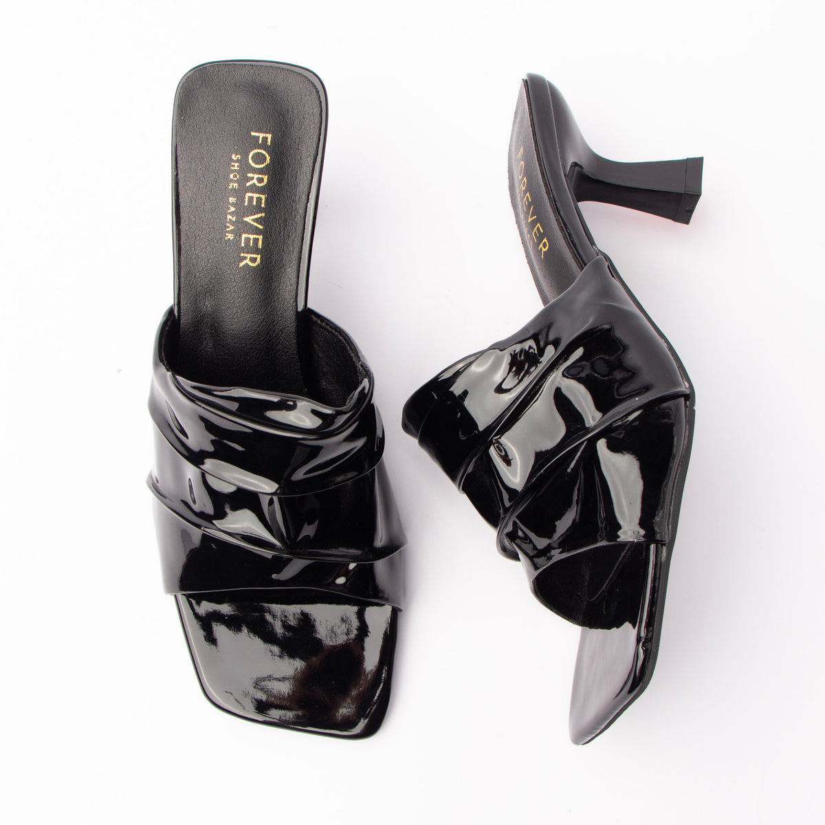 Black patent mules for women with a cushioned footbed