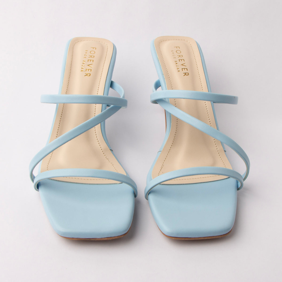 Blue mules for women, both shoes from the front
