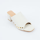 White block heel mules styled for party wear
