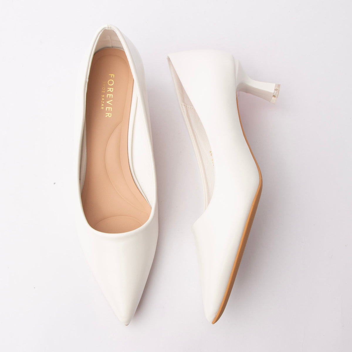 White pointed court shoes for women with a cushioned footbed