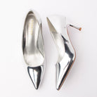 Silver pumps for women, both shoes laid flat