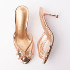 Champagne mules for women, both shoes laid flat