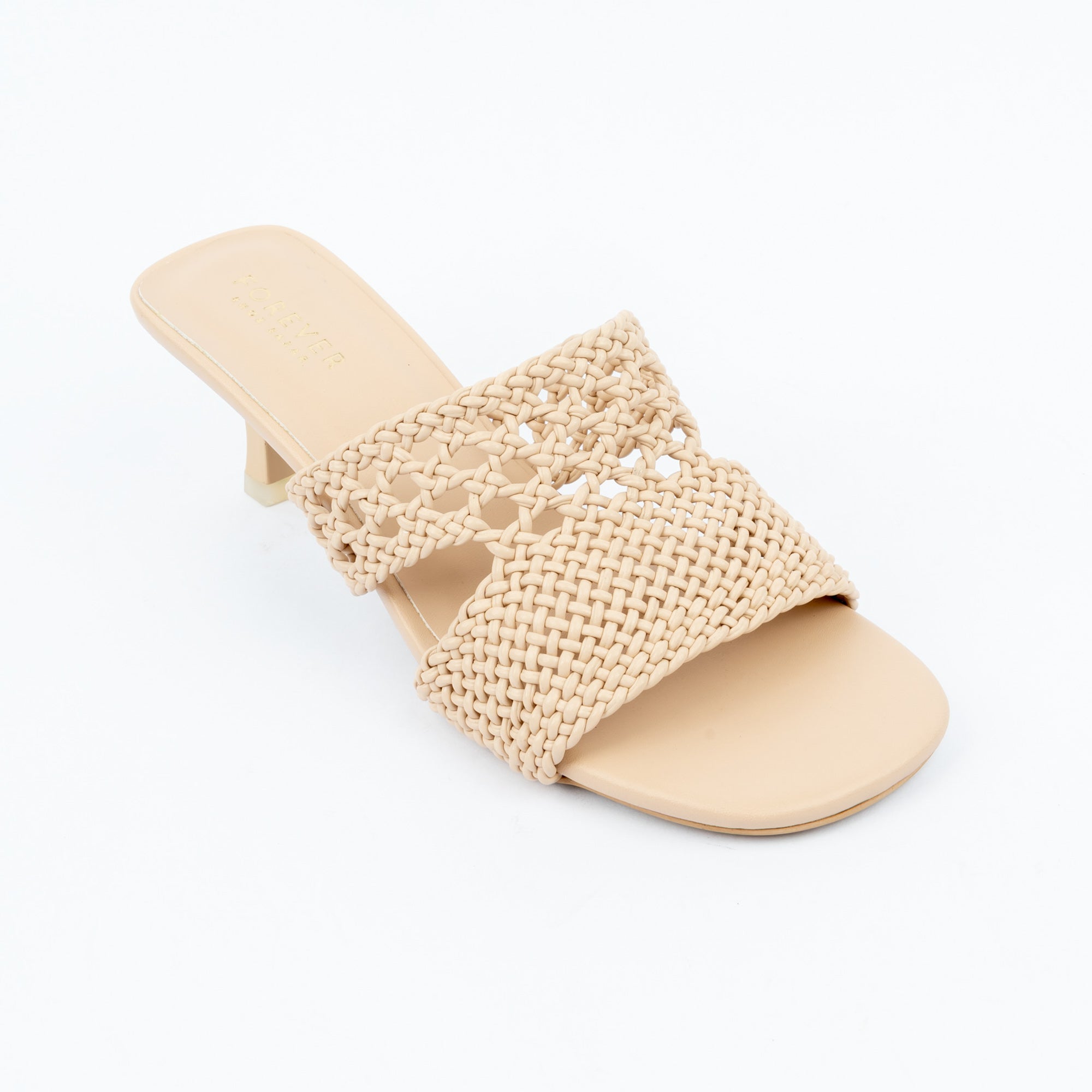 Beige kitten heel mules styled for casual wear