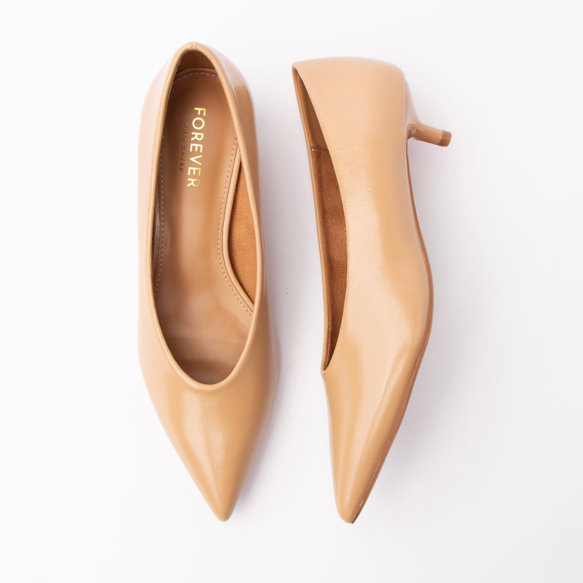 Beige pumps for women, both shoes laid flat