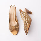 Copper embellished slingback pumps for women, dense gold-toned beadwork outlines a scalloped petal motif over nude mesh insets on a metallic bronze upper, with laser-cut teardrops through the quarter, a gathered elastic slingback strap, a tonal copper footbed and a polished bronze flared cone kitten heel