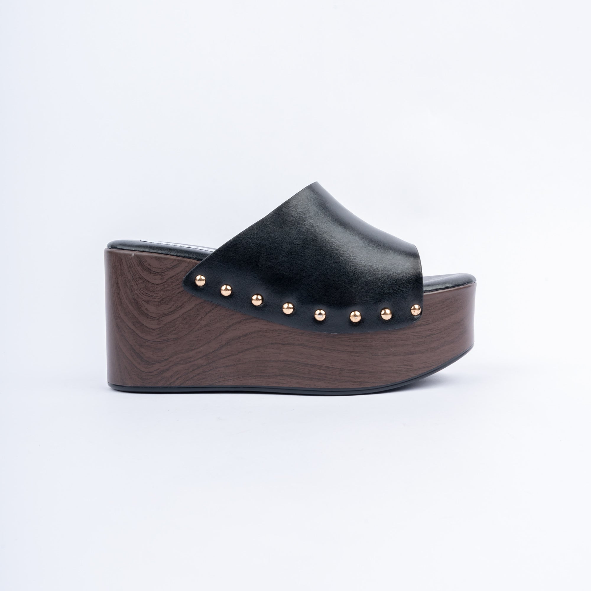 Black wedge heel mules for women, one plain band studded along a wood-look wedge