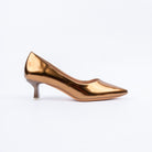 Brown pumps for women, a mirror-bright patent upper with a low V-cut topline and sharply tapered point, on a smoked translucent flared spool heel