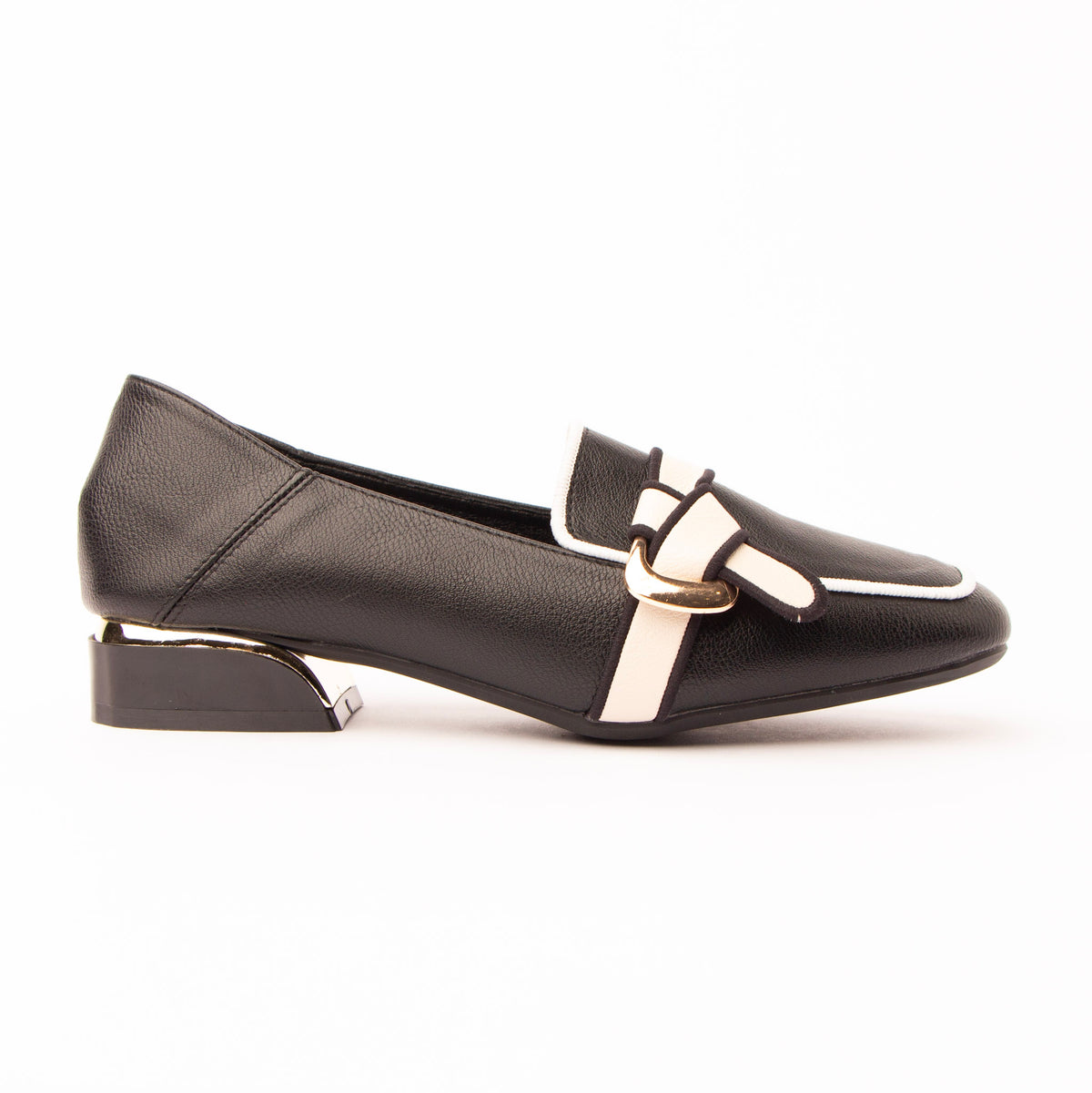 Black piped block heel loafers for women, a black lightly grained block-heel loafer with ivory piping tracing the apron seam and vamp panel, a knotted ivory strap drawn through a flat gold oval buckle and a squared heel plated in gold