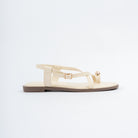 Cream flat sandals for women with cushioned footbed, side view