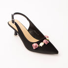 Black rosette slingback pumps styled for casual wear