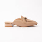 Khaki horsebit loafer mules for women, a warm sand-beige pebble-grain loafer mule with a polished gold horsebit link across the vamp, a moccasin apron seam round the square toe and a low block heel banded in gold above a nude padded footbed