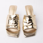 Gold metallic mules styled for everyday wear