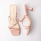 Pink mules for women, both shoes laid flat