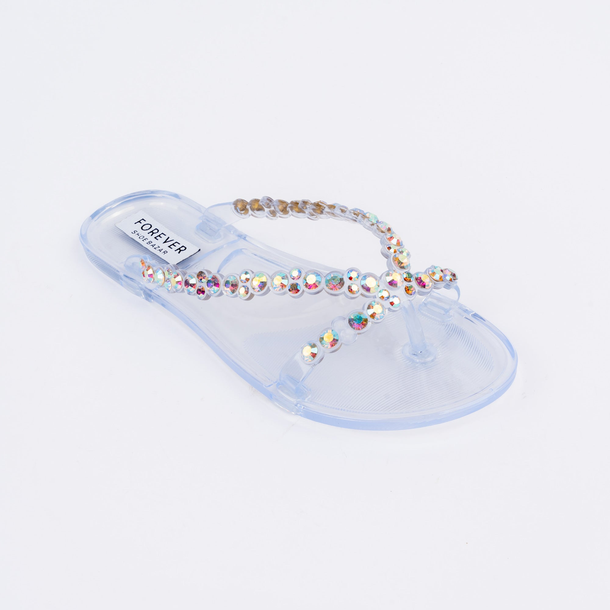 Transparent flat sandals styled for casual wear