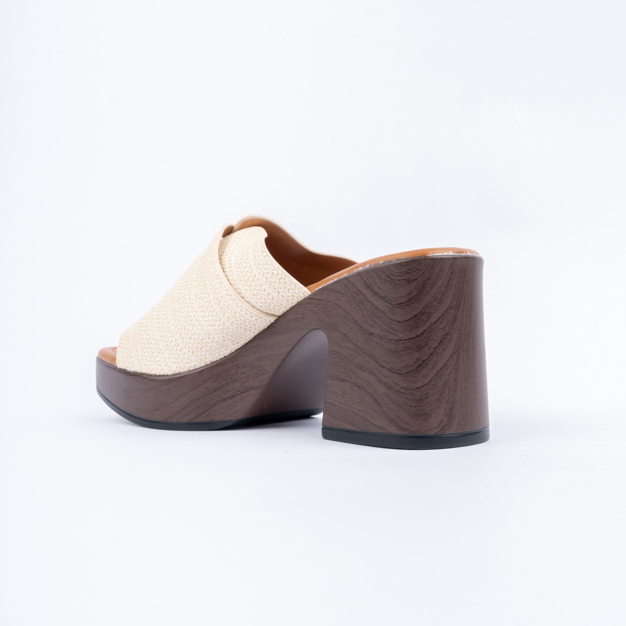Beige platform heel mules styled for casual wear